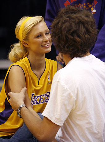 Paris Hilton (L) looks at Stavros Niarchos