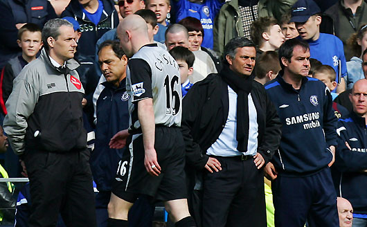 Everton's Lee Carsley (16) walks past Chelsea's manager Jose Mourinho (2nd R) after he was shown the red card during their 