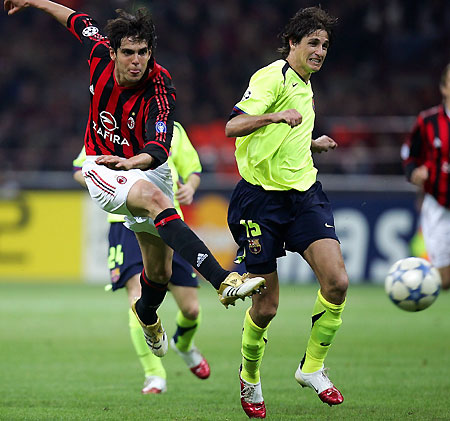 Milan's Kaka (L) shots as Barcelona's Edmilson