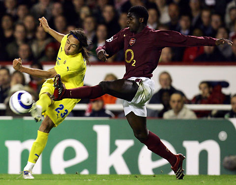 Villarreal's Jose Mari Romero (L) kicks the ball past Arsenal's Kolo Toure during their Champions League semi-final first leg s