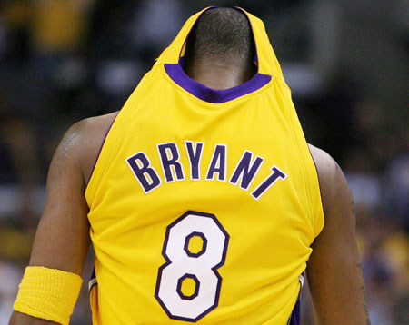 Los Angeles Lakers Kobe Bryant walks down the court after being called for a foul against the Phoenix Suns during their 99-92 win in Game 3 of the NBA Western Conference first round playoff series in Los Angeles April 28, 2006.