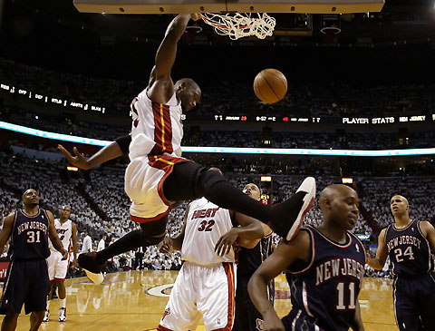 Miami Heat guard Dwyane Wade dunks the ball in the