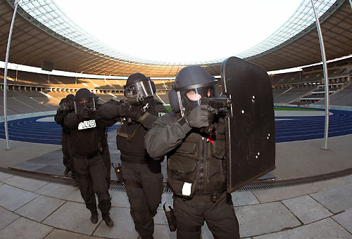 Members of Berlin's police special force (Spezialeinsatzkommando SEK) make their way during a drill to enter the Olympic stadium in this November 8, 2005 file picture in Berlin. Security preparations for the 32-nation tournament have focused on terrorism, hooliganism and petty crime, Berlin's police chief Dieter Glietsch told a news conference 11 days before the World Cup, during which Berlin will host six matches including the final. Picture taken November 8, 2005.