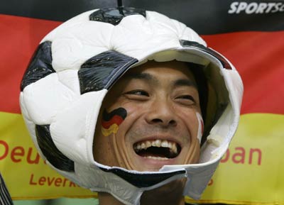 A Japanese supporter celebrates during a friendly soccer match between Germany and Japan in Leverkusen May 30, 2006. 