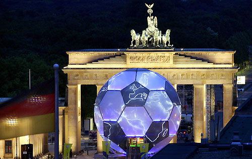 A giant 2006 FIFA World Cup globe is pictured during a illumination test next to Berlin's landmark Brandenburg Gate May 31, 2006. The 15 metre high soccer globe was created by Vienna-based cross-disciplinary artist Andre Heller. [Reuters] 