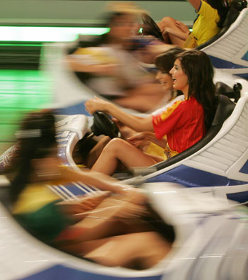 Participants of the 'Miss WM' contest drive in bumper cars before the final at the Europa Park amusement park in Rust June 1, 2006. 32 women representing nations that attend the FIFA 2006 Soccer World Cup take part in this competition on Thursday.