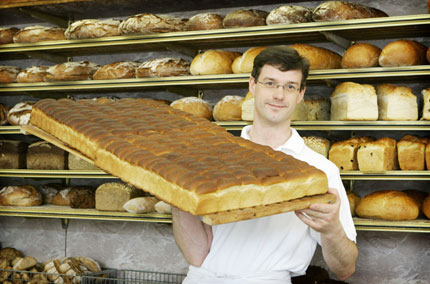 Heiner Fischer, owner of the eldest bakery 'Zwieback Fischer' poses in his premises in Dortmund May 22, 2006. The FIFA soccer World Cup 2006 will be held in Germany from June 9 - July 9.