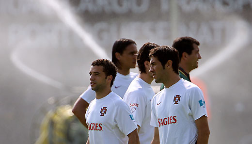 Portugal's (L-R) Simao Sabrosa, Fernando Meira, Hugo Viana and physical trainer Darlan Schneider arrive for the training session in Marienfeld, Northwest Germany June 8, 2006. The Portugal soccer squad will be playing the World Cup group D with Angola, Iran and Mexico.