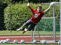 Spain's goalkeeper Iker Casillas tries to save the ball during a soccer training session at Spain's World Cup training centre in Kamen June 12, 2006. 