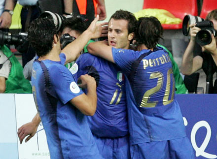 Italy's Alberto Gilardino (C) celebrates his goal against the U.S. with team mates Luca Toni (L) and Andrea Pirlo during their Group E World Cup 2006 soccer match in Kaiserslautern June 17, 2006.