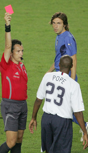 Eddie Pope (23) of the U.S. receives a red card from referee Jorge Larrionda of Uruguay during their Group E World Cup 2006 soccer match against Italy in Kaiserslautern June 17, 2006.