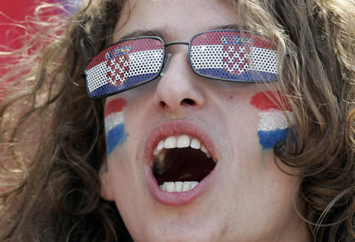 A Croatia fan waits in the stands before the Group F World Cup 2006 soccer match between Japan and Croatia in Nuremberg June 18, 2006. [Reuters]
