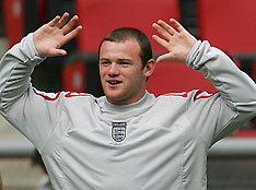Wayne Rooney reacts during the team's official practice at Cologne's stadium during the World Cup soccer tournament June 19, 2006 