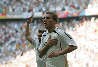 Germany's Lukas Podolski (front) celebrates with team mate Bernd Schneider after scoring his team's second goal against Sweden during their second round World Cup 2006 soccer match in Munich June 24, 2006.