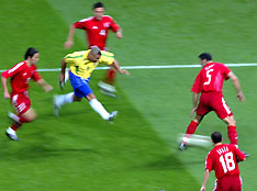 Turkey's Bulent Korkmaz (L), Fatih Akyel, Alpay Ozalan and Ergun Penbe (R) watch Ronaldo (Centre L) of Brazil scores a goal during their World Cup semi-final match in Saitama in this June 26, 2002 file photo. 