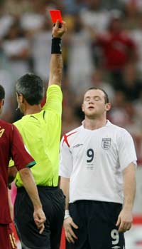 Referee Horacio Elizondo of Argentina shows England's Wayne Rooney a red card during their World Cup 2006 quarter-final soccer match against Portugal in Gelsenkirchen July 1, 2006. 
