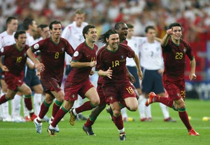 Portugal players celebrate after winning the penalty shootout in the World Cup 2006 quarter-final soccer match between England and Portugal in Gelsenkirchen July 1, 2006. [Reuters]