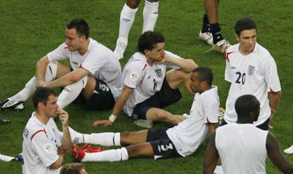 England players react after Portugal defeated England in their World Cup 2006 quarter-final soccer match in Gelsenkirchen July 1, 2006. [Reuters]