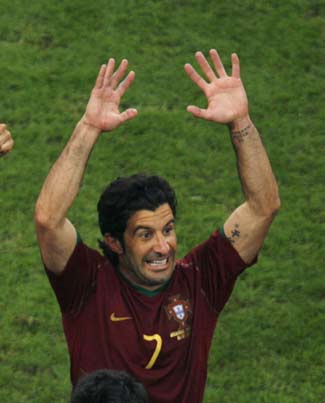 Portugal's Luis Figo celebrates after the penalty shootout in the World Cup 2006 quarter-final soccer match between England and Portugal in Gelsenkirchen July 1, 2006. [Reuters]