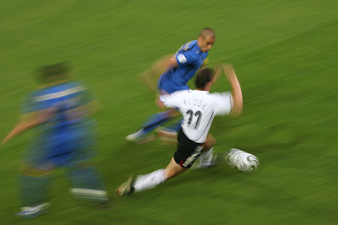 Italy's Fabio Cannavaro challenges Germany's Miroslav Klose (11) for the ball during their World Cup 2006 semi-final soccer match in Dortmund July 4, 2006.
