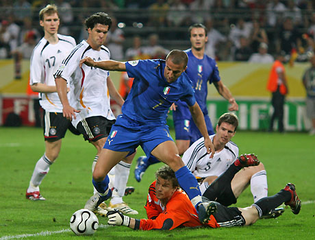 Italy's Fabio Cannavaro challenges Germany's Miroslav Klose (11) for the ball during their World Cup 2006 semi-final soccer match in Dortmund July 4, 2006.