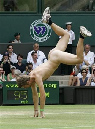 An unidentified streaker does a cartwheel, as he interrupts the Women's Singles quarter-final match between Maria Sharapova and Elena Dementieva, both of of Russia, on the Cemtre Court at Wimbledon, Tuesday, July 4, 2006. [AP Photo]
