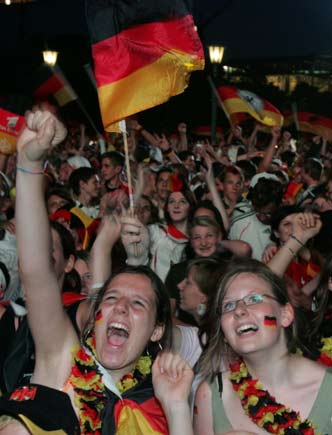 Soccer fans of Germany react during the World Cup soccer match between Germany and Portugal at a "fan festival" in Stuttgart, July 8, 2006. [Reuters]