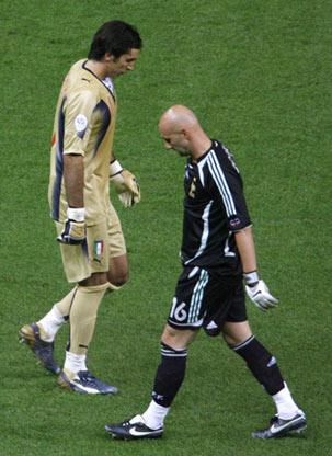 France's goalkeeper Fabien Barthez (R) walks past Italy's goalkeeper Gianluigi Buffon during their World Cup 2006 final soccer match between against Italy in Berlin July 9, 2006.