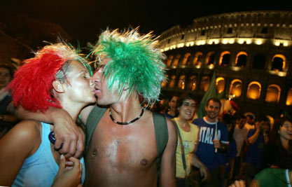 Soccer fans celebrate Italy's World Cup 2006 triumph, outside the Colosseum in Rome July 9, 2006.
