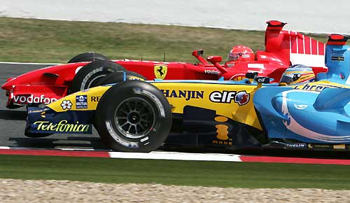 Renault Formula One driver Fernando Alonso of Spain makes a pit stop during the French Grand Prix at the Magny-Cours circuit July 16, 2006.