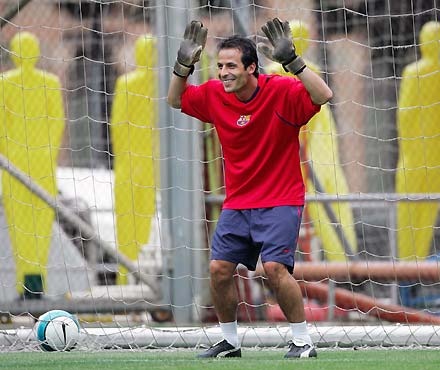 Barcelona's striker Ludovic Giuly from France trains as a goalkeeper during their first training session for the next season at Barcelona's Nou Camp stadium July 17, 2006.
