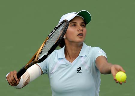Sania Mirza of India serves to Alexandra Stevenson of the U.S. during their match of the 2006 Western & Southern Financial Group Women's Open tennis tournament in Cincinnati, July 18, 2006