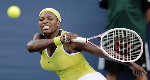 Serena Williams of the U.S. returns a shot to Anastasia Myskina of Russia during their first round match of the Cincinnati Open Women's Singles tennis tournament in Cincinnati, July 18, 2006.