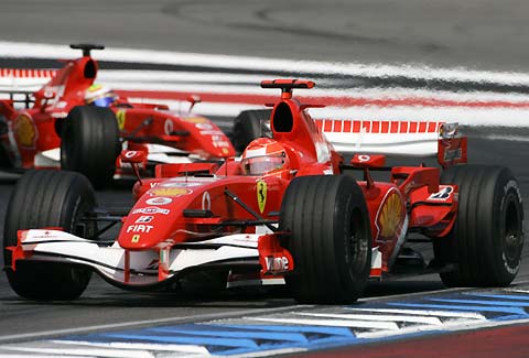 Ferrari driver Michael Schumacher of Germany, followed by team mate Felipe Massa, take a curve on the Hockenheim circuit during the German Grand Prix in Hockenheim, July 30, 2006.