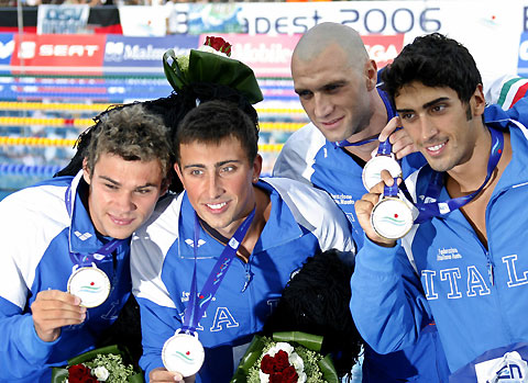 Italy's men's 4x100 m freestyle relay team display their gold medals after winning the European Aquatic Championships in Budapest July 31, 2006. Pictured are: Christian Galenda (L), Alessandro Calvi (2nd L), Lorenzo Vismara (2nd R) and Filippo Magnini. [Reuters]
