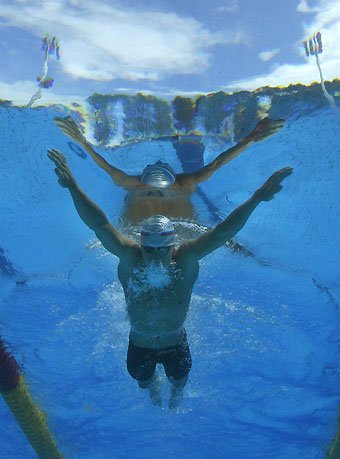Dmitry Komornikov of Russia is seen underwater as he swims during the heats of the men's 200 m breaststroke event at the European Aquatic Championships in Budapest August 2, 2006. 