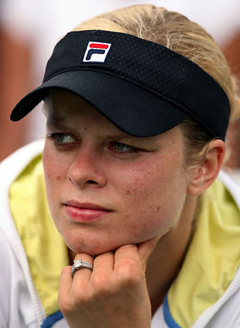 Kim Clijsters of Belgium sits after losing to Russia's Maria Sharapova in the final of the Acura Classic women's tennis tournament in Carlsbad, California August 6, 2006. 