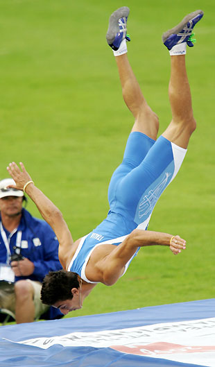 Italy's Giulio Ciotti performs a somersault after failing to clear the bar in the high jump at the European athletics championships in Gothenburg (Goteborg) August 9, 2006.