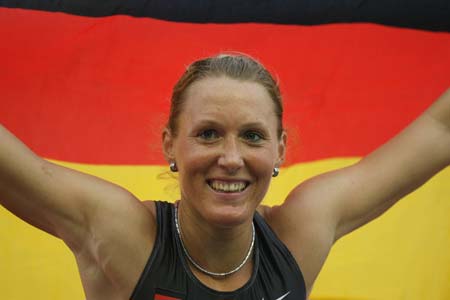 Germany's Kirsten Bolm celebrates after winning the bronze medal in the women's 100 m hurdles at the European athletics championships in Gothenburg (Goteborg), August 11, 2006.