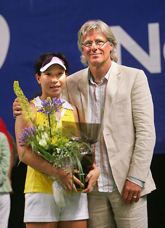 Russia's Anastasia Myskina returns a shot to China's Zheng Jie during the finals of the Stockholm Open tennis tournament in Stockholm, Sweden August 13, 2006. 