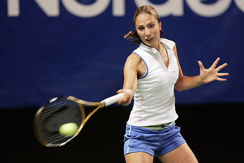 Russia's Anastasia Myskina returns a shot to China's Zheng Jie during the finals of the Stockholm Open tennis tournament in Stockholm, Sweden August 13, 2006. 
