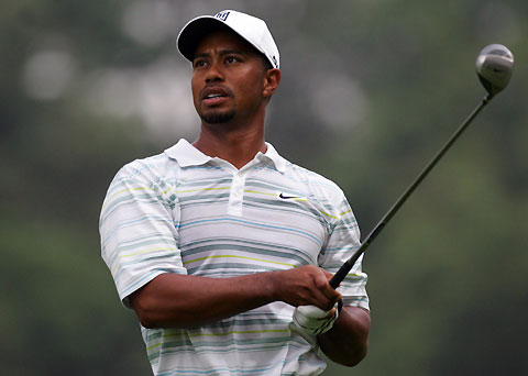 Tiger Woods watches his ball on the 14th fairway during the first day of practice for the 88th PGA Championship in Medinah, Illinois,August 14, 2006. 