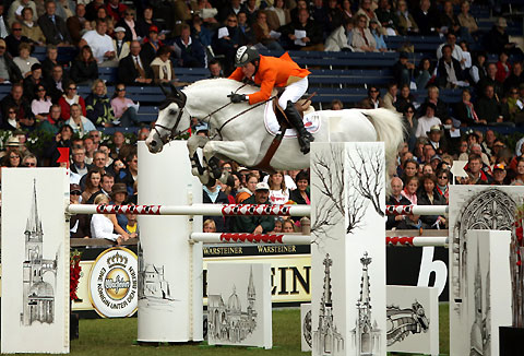 Netherlands' Gerco Schroder clears a jump on Berlin during the 2nd qualification for the FEI World Showjumping Championship at the World Equestrian Games in Aachen August 30, 2006.