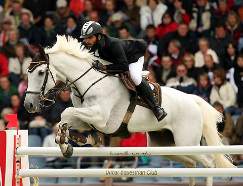 United Arab Emirates' Mohammed Al Kumaiti clears a jump on Al Mutawakel during the 2nd qualification for the FEI World Showjumping Championship at the World Equestrian Games in Aachen August 30, 2006.