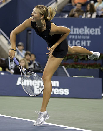 Russia's Maria Sharapova sits during a break in play during her match against Michaella Krajicek of the Netherlands at the U.S. Open tennis tournament in New York, August 30, 2006.