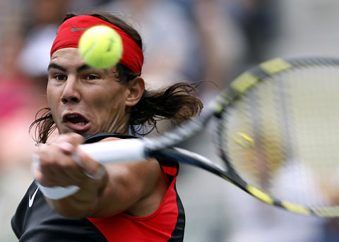 Spain's Rafael Nadal plays a shot to Australia's Mark Philippoussis during their match at the U.S. Open tennis tournament in New York, August 30, 2006.