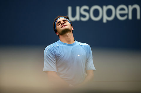 Switzerland's Roger Federer reacts after losing a point to Taiwan's Wang Yeu-Tzuoo during their match at the U.S. Open tennis tournament in New York, August 30, 2006. 