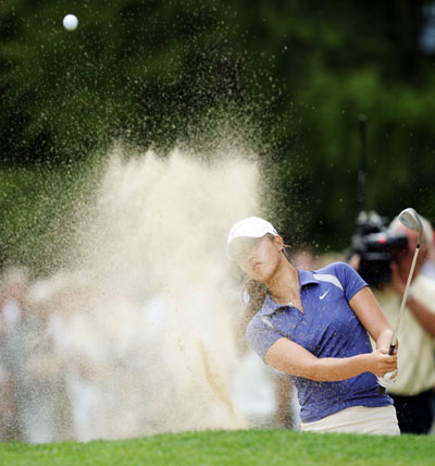 Michelle Wie of the U.S. hits out of a bunker on the 16th hole during the first round of the European Masters golf tournament in Crans-Montana September 7, 2006. 