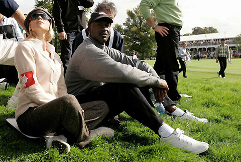 Former U.S. basketball star Michael Jordan (R) and Elin Nordegren, wife of U.S. Ryder Cup player Tiger Woods, watch the flight of the ball on the 16th hole during the fourball golf match at the Ryder Cup tournament at The K Club in County Kildare, Ireland, September 22, 2006.