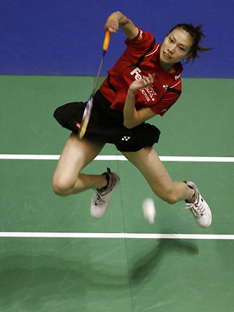 Xie Xingfang of China smashes the shuttlecock to compatriot Zhang Ning during their women's singles final match at the World Badminton Championships in Madrid September 24, 2006. 